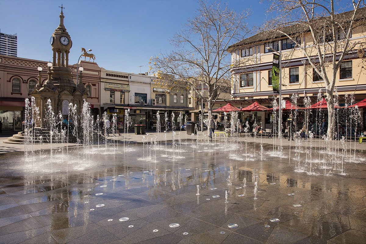 The redeveloped Centenary Square water fountain featuring the historic Centennial Memorial Clock. Church Street, Parramatta. Image credit: Destination NSW