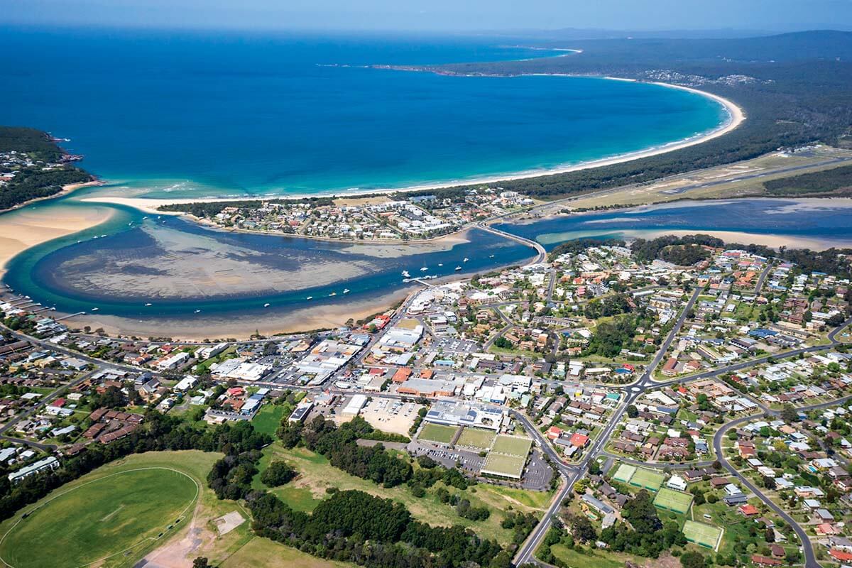 Aerial image of Merimbula looking onto Merimbula Bay. Merimbula NSW. Credit: NSW Department of Planning, Housing and Infrastructure / Jaime Plaza Van Roon