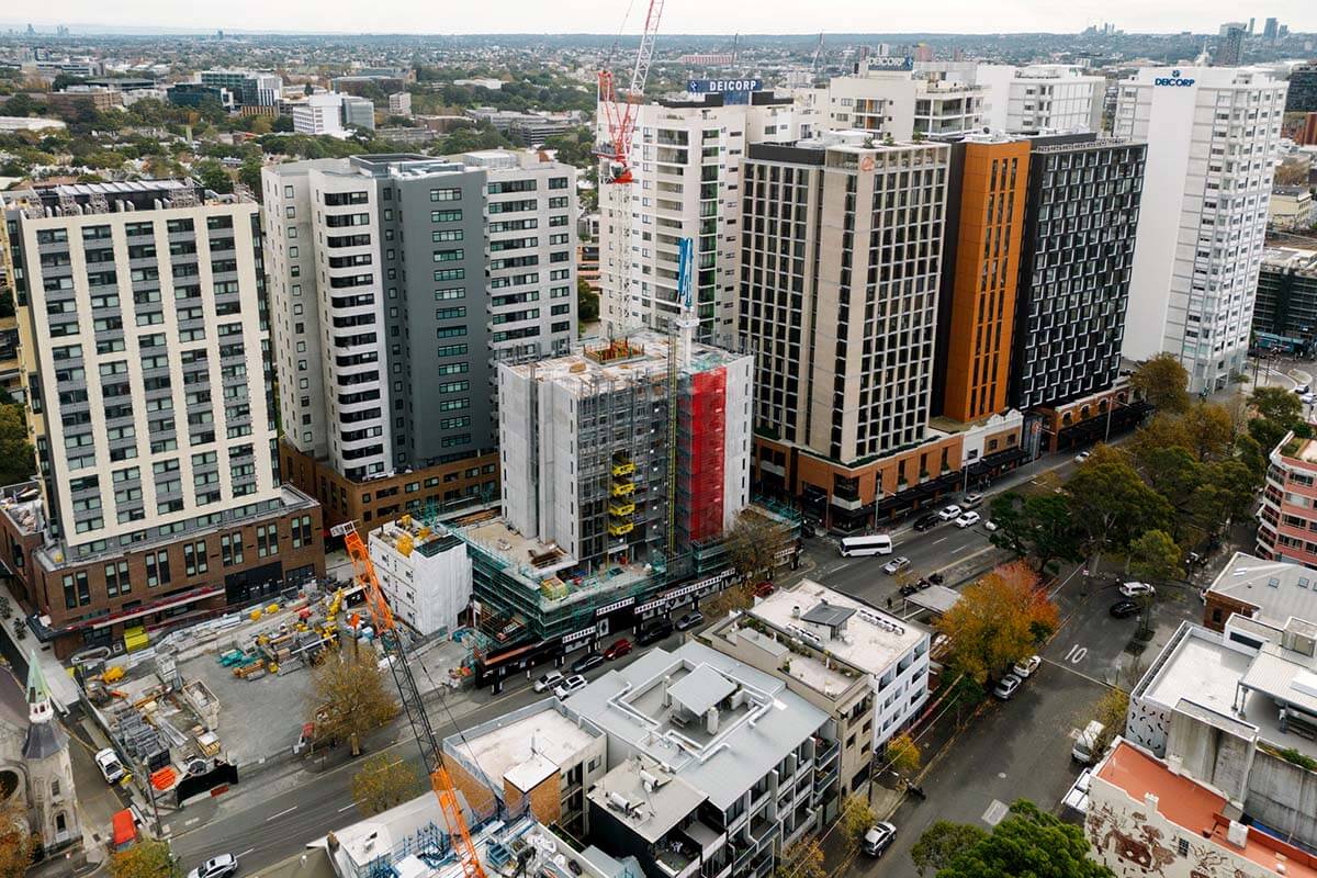 Aerial view looking down and across a range of mixed density housing developments at Waterloo NSW. Credit: Mikey Matthews/DPE